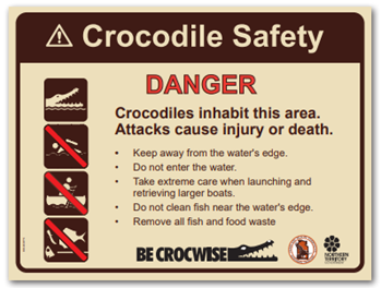 Crocodile safety sign for areas where visitors do fish and launch boats but do not camp.